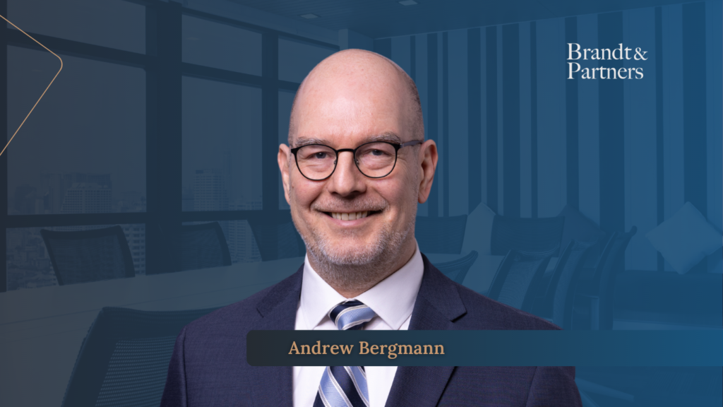 Business leaders reviewing a 100 day post acquisition plan in a modern office